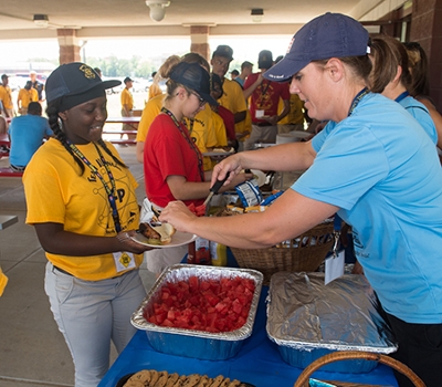 SIUE Police Lt. Lisa Johnson served lunch to a cadet at the SIUE RecPlex.